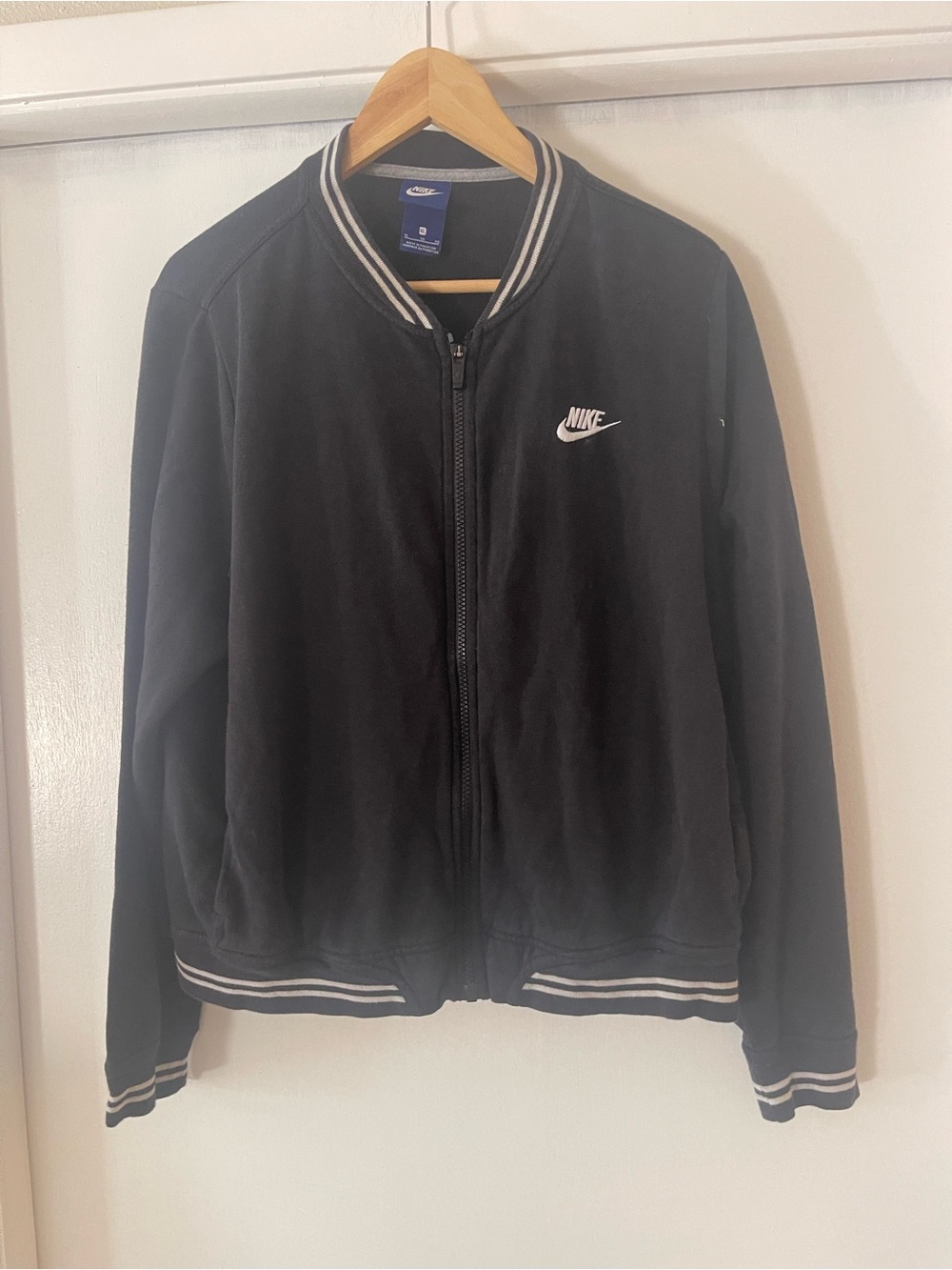Women’s Nike Black varsity Jacket with White Logo and Stripe Trim